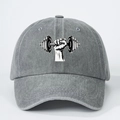 Detailed view of gray washed cotton baseball cap with dumbbell graphic and curved brim - Gray