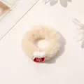 Detailed view of plush cream scrunchie with festive red snowflake Christmas sock ornament - Christmas Plush Hair Tie - Christmas Sock