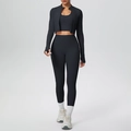 Detailed view of black three-piece yoga set including zip jacket, sports bra and leggings - S / Black