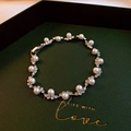 Elegant white freshwater pearl bracelet with rhinestone accents on green velvet background - Pearl Irregular Wavy Bracelet