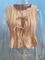 Close-up of beige pleated cotton linen sleeveless top with front bow tie details - Dusty Rose Jacket