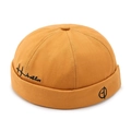Bright yellow cotton brimless Miki hat with black embroidery and vintage aesthetic - Yellow