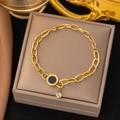 Gold thick chain bracelet with black enamel Roman numeral pendant on a brown jewelry gift box - Roman Luxury Gold