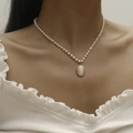 Elegant pearl choker necklace featuring an oval opal pendant with textured gold border - Pearl Cat Eye Pendant Necklace (01白色DZ-275) / White