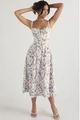 Detail of white midi dress with blue floral print and elegant slim-fit waist design - S / Tops / White With Blue Floral