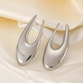 Polished silver U-shaped hoop earrings featuring a minimalist metallic horseshoe design - Hollow Oval Style (6130) / 02 Silver