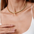 Elegant 18K gold plated stainless steel snake bone chain necklace worn by a model - 8mm Soft Snake Chain