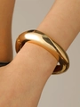 Polished chunky gold-finish bangle with a minimalist irregular hip-hop cuff design - Polished Bangle (9498) / KC Gold