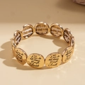 Bracciale elastico con medaglione geometrico dorato e testo motivazionale in rilievo - Stile Medaglia Religiosa / Oro