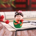 Macro shot of ancient Chinese lady figurine made of resin with vintage book background - Small Dancing Style (1056-2B)