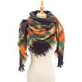 Plaid checkered scarf in orange, green and black with fringe on a mannequin - Orange Black Plaid