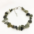 Detailed macro view of irregular raw labradorite gemstone beads with silver lobster clasp - Flash Stone (Labradorite)