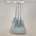 Detail of blue and white gingham canvas hobo bag showing tied knot shoulder strap design - Cyan Yellow Plaid