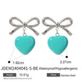 Silver bow heart earrings featuring a vibrant turquoise green 3D heart pendant - Teal Blue