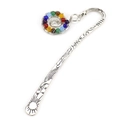 Macro view of silver metal bookmark with spiral pendant and colorful chakra beads - Silver + Multicolor