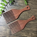 Two dark wood wide tooth beard combs with hanging holes on a wooden background - Amodon Wood Comb 16x6CM