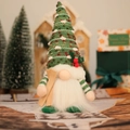 Knitted green gnome with wooden skis and red berries for Christmas home decor - Green Lighted Gnome / Green
