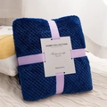 Dark blue flannel pineapple grid blanket tied with lavender ribbon and brand label - Dark Blue