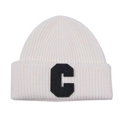 Detailed texture of off-white ribbed knit beanie with black terry embroidered letter C - White with Black Tag