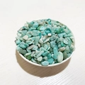Natural turquoise and amazonite tumbled stones in a white dish for DIY jewelry and decor - Amazonite