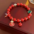 Bracciale di perle in agata rossa con ciondolo Fu e accenti dorati su scatola di legno - 12# Bracciale-Rosso-Sacchetto della Fortuna Fu