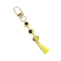 Detail of evil eye keychain with yellow resin beads and gold plated tassel charm - Yellow