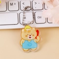 Cute acrylic cartoon bear keychain in yellow nightcap and blue apron on ball chain - Calling Bear