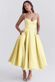 Detail of yellow A-line dress with spaghetti straps and white mesh inner lining - Yellow