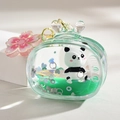 Dettaglio portachiavi panda con liquido verde, paillettes e ciondolo a ciliegio - Forma TV e Ciondolo Sakura / Verde