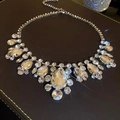 Close-up of shimmering crystal statement necklace with teardrop stones on dark leather base. - Chain Only / 6# Silver Waterdrop Cluster