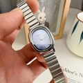 Elegant women's silver alloy watch with an oval blue dial and minimalist bar indices - Silver Band Blue Dial