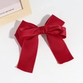 Close-up of deep red satin bow hair clip with elegant double-layered ribbon texture - Red