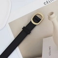 Minimalist black leather belt for women featuring a gold oval buckle and fine stitching - Black