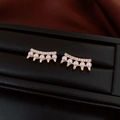 Detailed close-up of gold spike pearl earrings with sparkling zircon on black leather - Silver Needle-Gold-Pearl Spikes(55#)