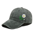 Detailed close-up of daisy embroidery on vintage washed grey baseball cap side - One Size / Army Green