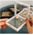 Detailed view of high-elastic PE film holding a pearl bracelet inside a jewelry display box - 5x5cm / White