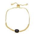 Detail of adjustable gold bracelet with oval black zircon stone and golden bead chain - Black