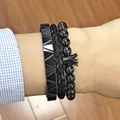 Close-up of three-piece men's set featuring black crown beads, braid, and textured bangle - Triangle Beaded Crown Black Set