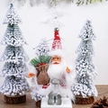 Detail of 5-inch plush Santa doll with hanging loop in a snowy forest decor setting - Snowflake Outfit