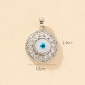 Detail of silver evil eye pendant with blue zircon center and dimensions 2.6cm by 1.9cm - A-7 Style/White Base Blue Eye