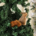Close-up of a furry brown squirrel ornament with a fluffy tail on a green Christmas tree - Style 7 (26x9x14.5cm)
