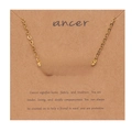 Detail of 18k gold plated Cancer zodiac necklace displayed on a Kraft paper card - Gold-Cancer