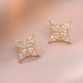 Elegant gold-plated star stud earrings with sparkling cubic zirconia on silk background - Four-Pointed Star Shape (E0919) / Gold