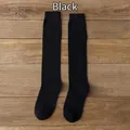 Classic black knee-high JK uniform socks with vertical ribbed knit texture for women - One Size / Black