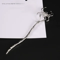 Vintage silver metal hair stick featuring a unique spider skull design and textured body - Silver