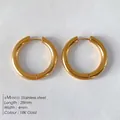 Classic 18K gold plated stainless steel hoop earrings with 28mm diameter and 4mm width - Gold (NE93149)