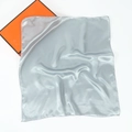 Detail of silver gray silk square scarf featuring rolled edges and satin finish - Light Gray