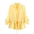 Detail of yellow long sleeve shirt featuring a drawstring waist and front flap pocket - S / Yellow Shirt