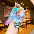 Cute liquid quicksand bear keychain with purple glitter and a gradient silicone strap - White Sitting Bear with Gradient Rope