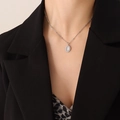 Bohemian silver necklace featuring an oval cat-eye stone pendant on a chic bobo chain - Silver Cat Eye Stone Necklace